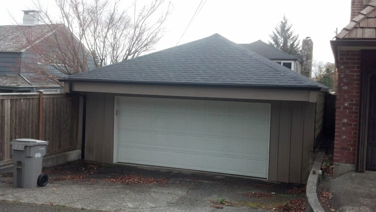 Dark gutter along the roofline of a detached garage