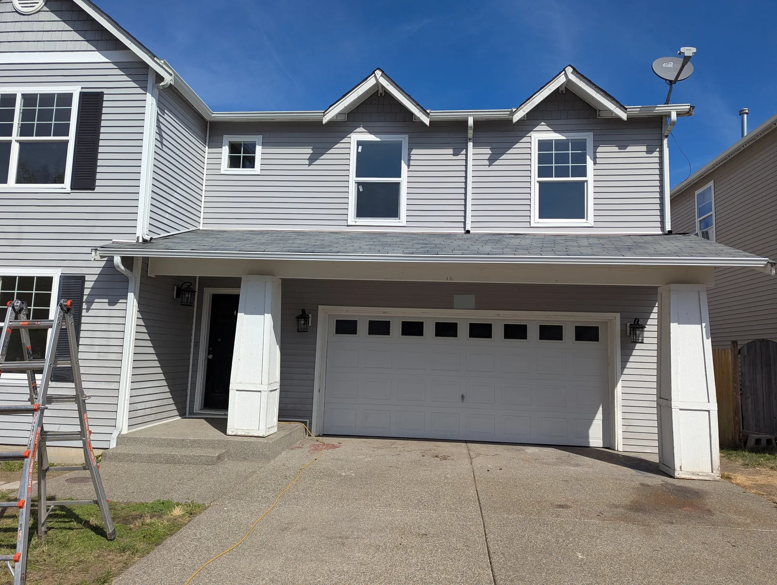 Spanaway home after replacement lower gutter and downspout installation